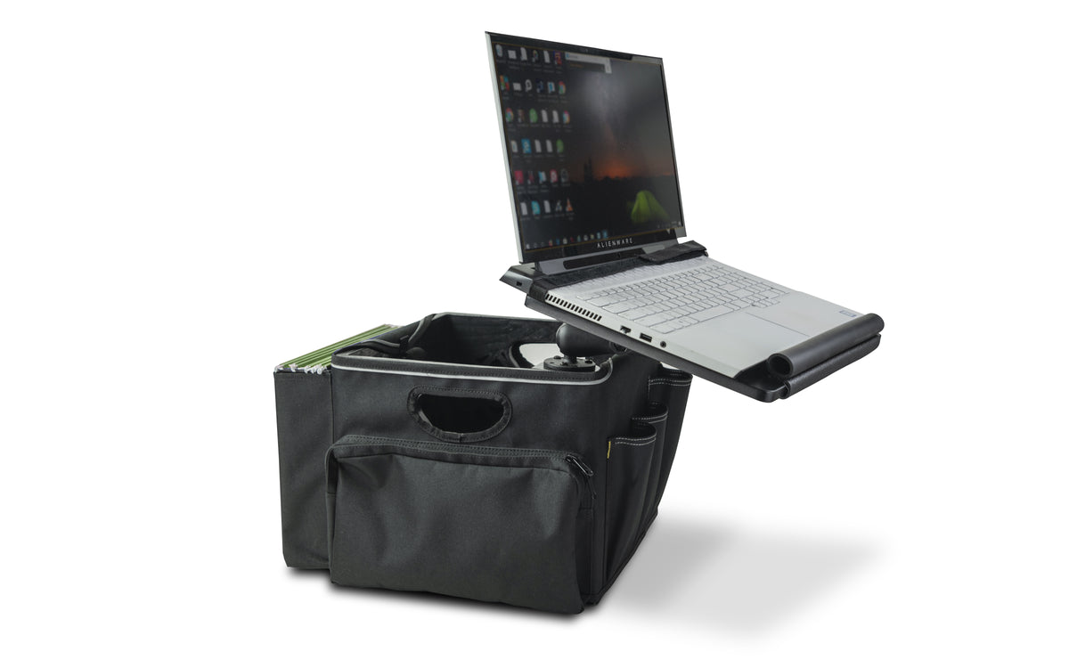 a black workstation vehicle organizer designed for in-car use. It features multiple compartments for storage, including a side pocket. A laptop is placed on an adjustable laptop tray with a tilting top is mounted on a sturdy stand, allowing for ergonomic positioning of a laptop.