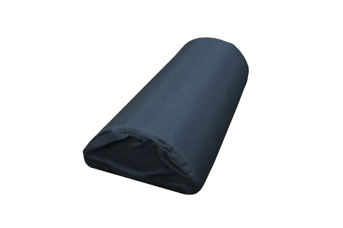 A cylindrical navy blue bolster pillow made of a smooth fabric, sewn shut at both ends and it has slight creases