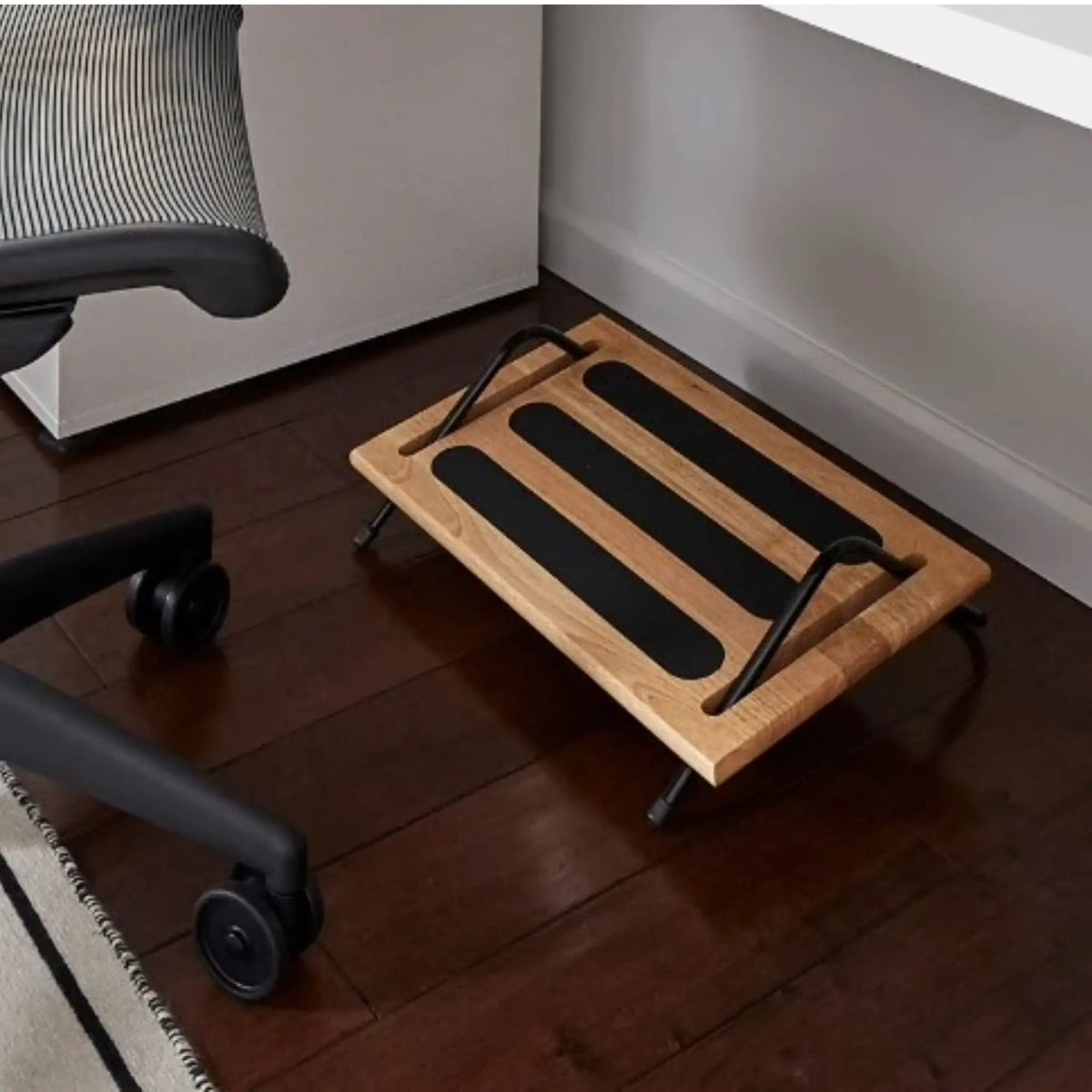 Ergonomic Foot Rocker under an office chair set up for all day comfort of the feet