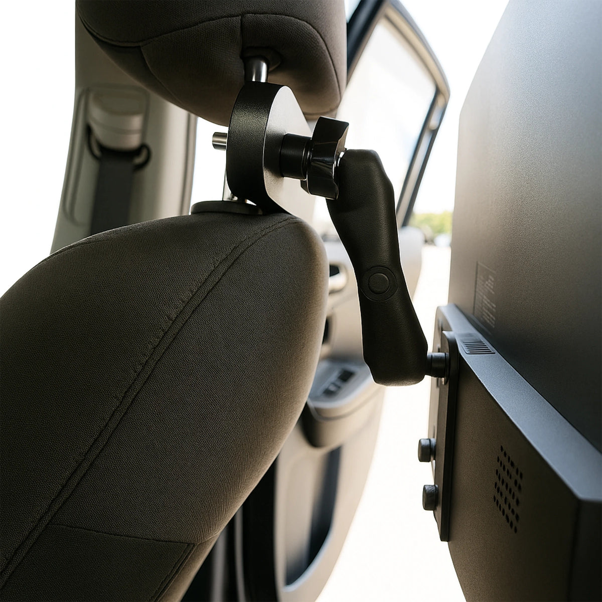 Side view of monitor mounted to the back of a car seat headrest with the backseat monitor mount