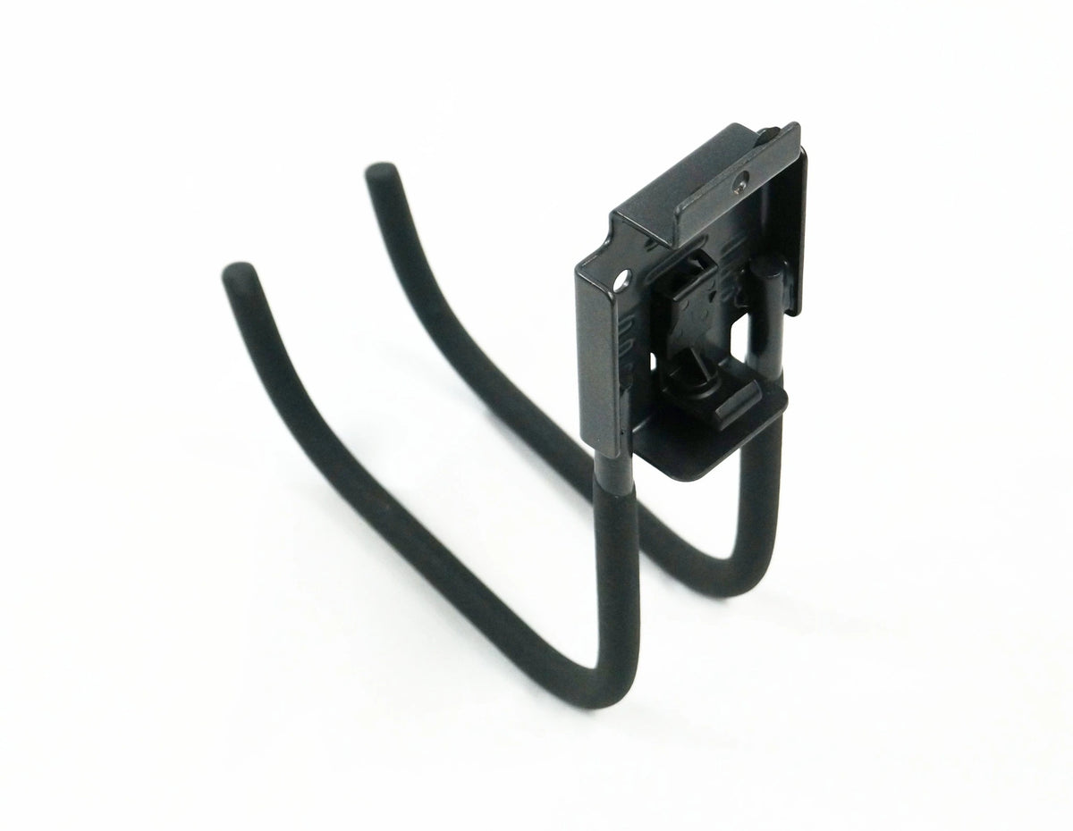 The back view of a black J shaped hook featuring a rectangular metal piece with ridged pieces of metal on the sides and top with screw holes for placement on a slatwall hutch