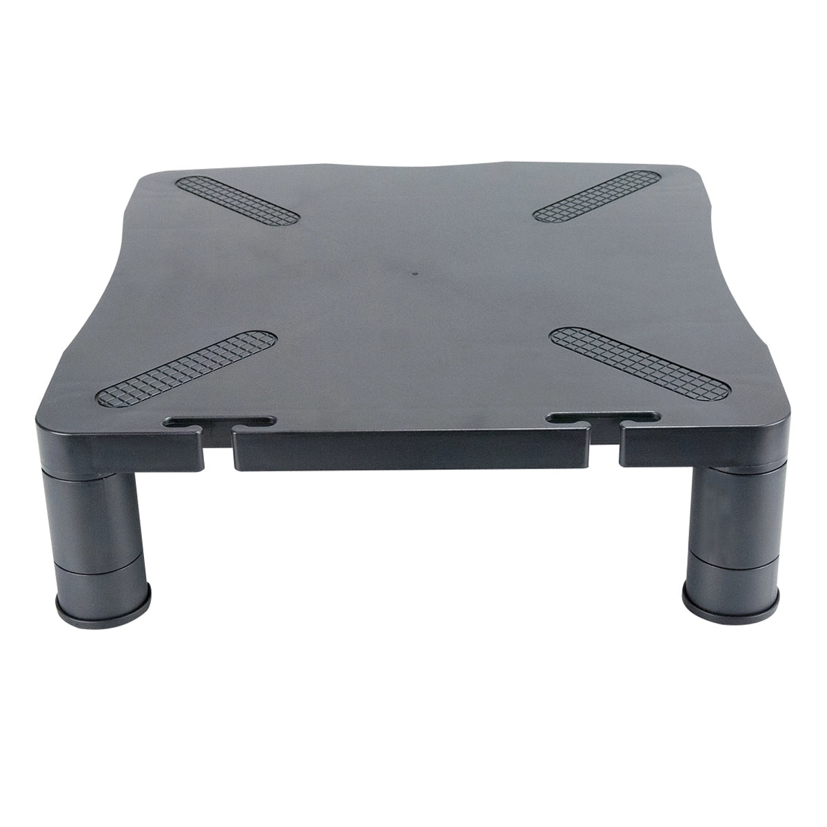 the front view of a sturdy black plastic monitor stand with a flat, rectangular top with rounded corners and is supported by four cylindrical legs. The top surface includes textured, anti-slip pads at each corner to secure the monitor in place