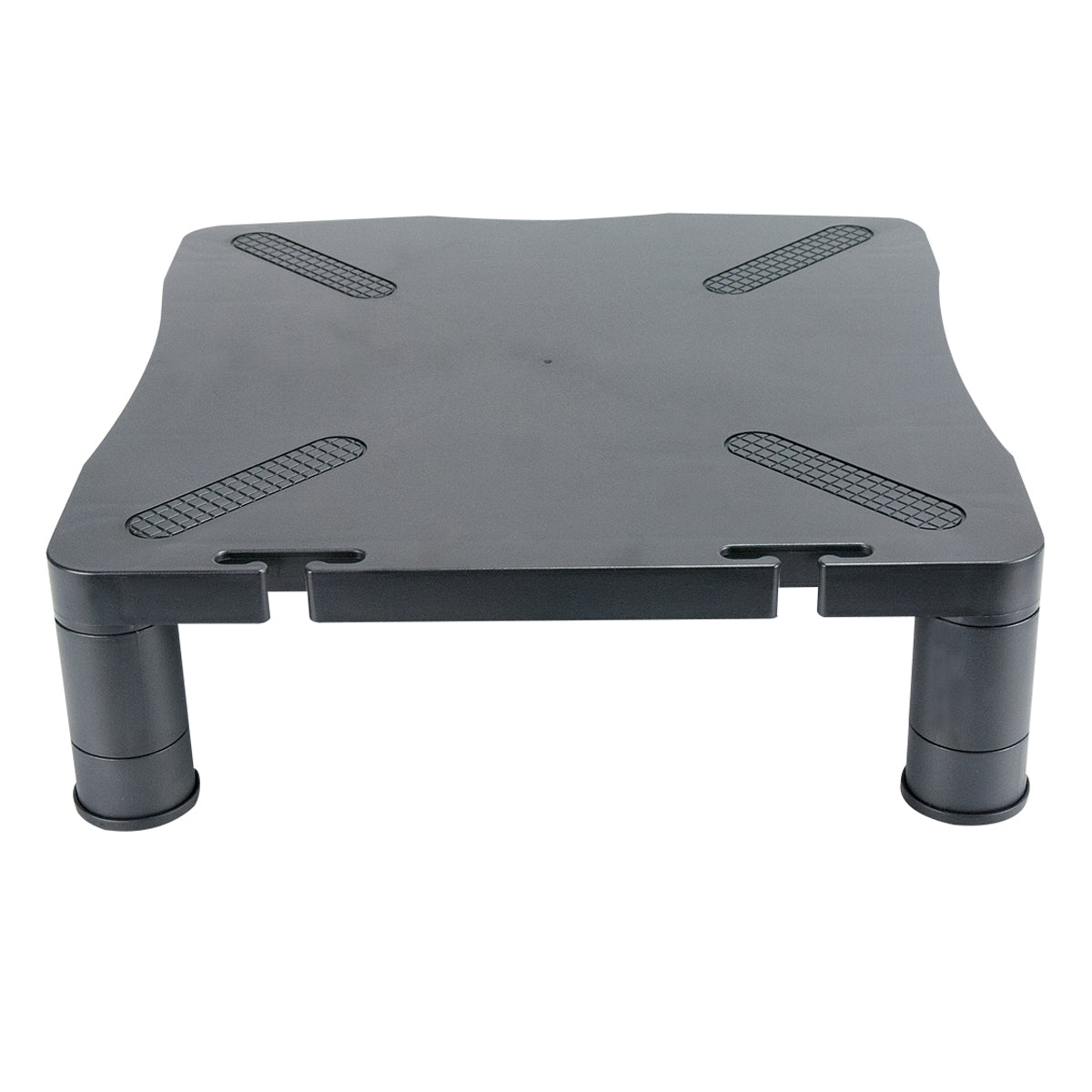 the front view of a sturdy black plastic monitor stand with a flat, rectangular top with rounded corners and is supported by four cylindrical legs. The top surface includes textured, anti-slip pads at each corner to secure the monitor in place