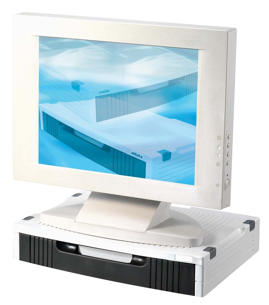 a sturdy black and white plastic monitor stand designed to support a computer screen. It features a white top with horizontal grooves and a black drawer at the front. A large white computer monitor sits on top