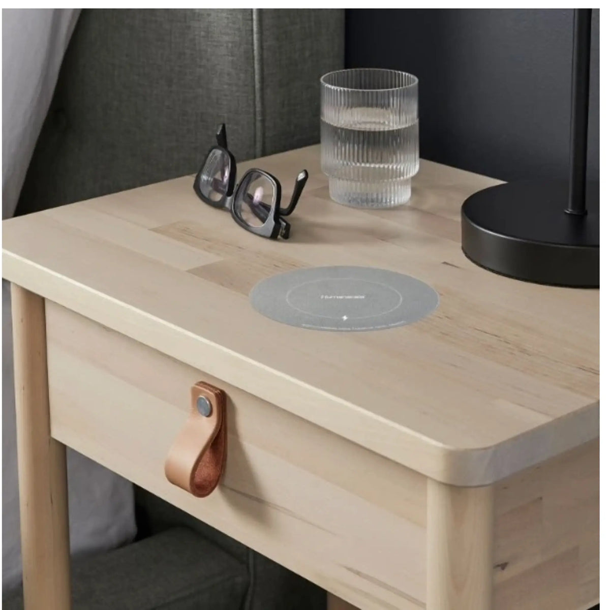 NeatCharge Wireless Underdesk Charger used on a nightstand