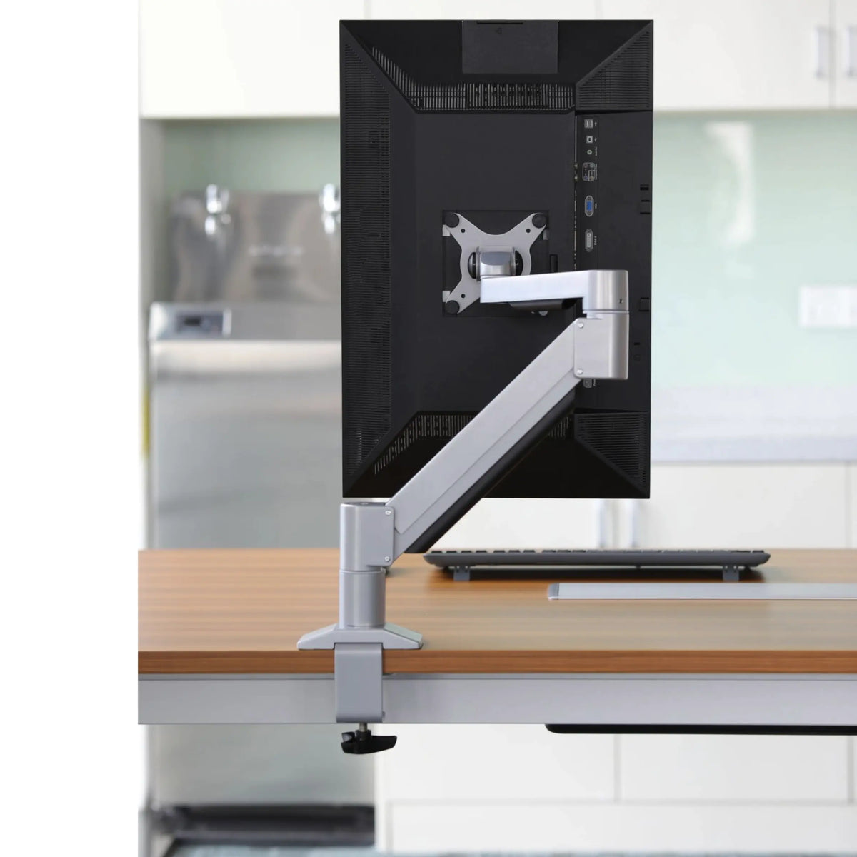 Monitor arm showing rotation ability, so the monitor is sideways for the user&#39;s preference