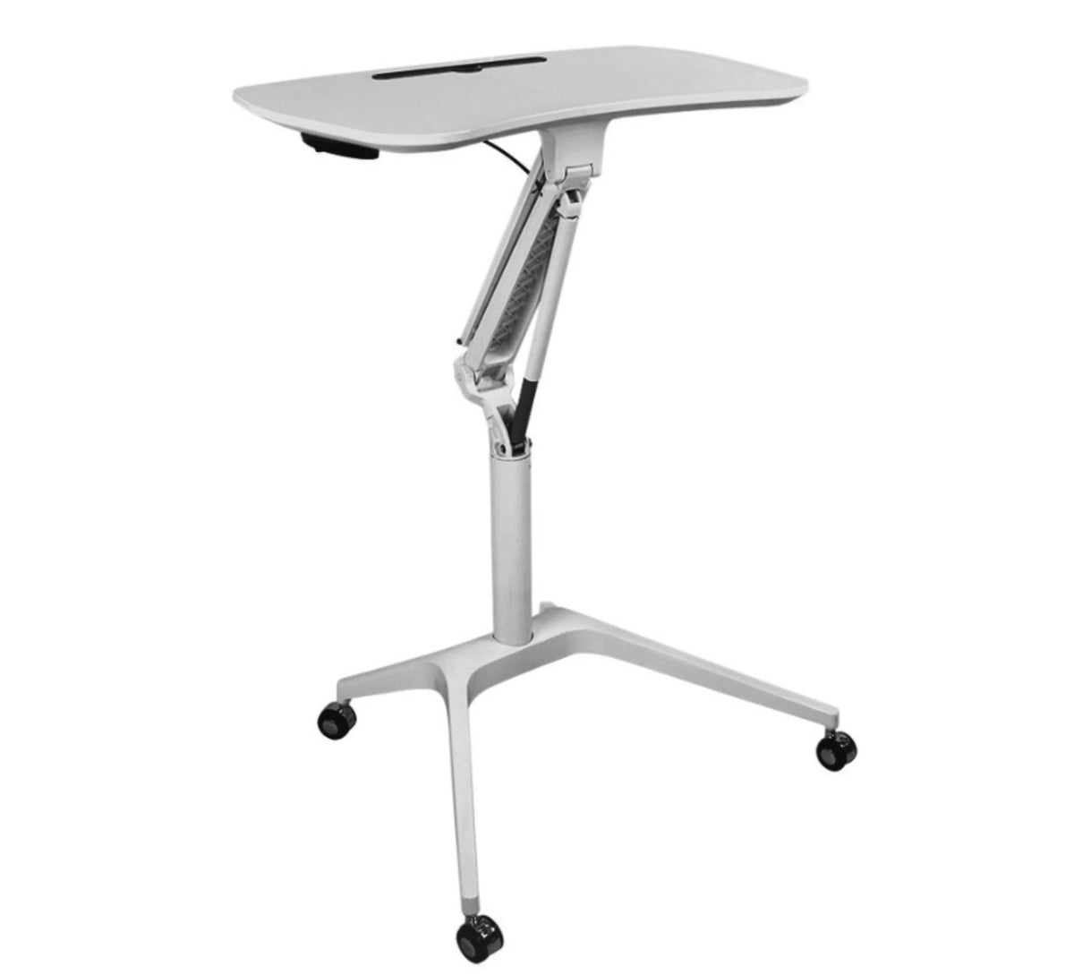 A modern, height-adjustable desk with a white finish. The desk features a single, flat tabletop with rounded corners and a slim slot near the back edge for organizing cables or small stationery items. The support structure consists of a central column that branches out into an inverted Y-shape at the bottom, ending in a three-pointed star formation with lockable caster wheels for mobility