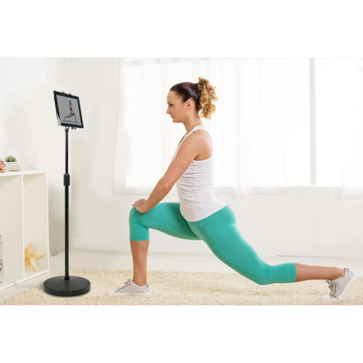 Universal Tablet Weighted Base ViewStand (XL) playing a follow along workout for the user