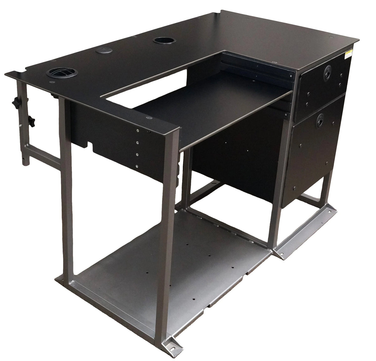 a right-angled view of a small black desk with silver metal frame and a set of drawers located on the right side. The work surface features two empty grommet holes located at the top and a dropped down keyboard tray in the center. The back of the desk has a connected metal pole for the optional mounting of a slatwall hutch. The bottom of the desk is connected with a large sheet of gray metal. 