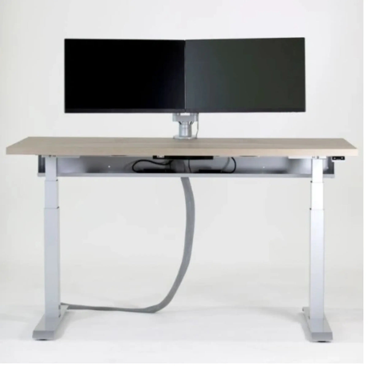 Desk with a computer monitor and 
a Vertical Mesh Cable Sleeve on a white background