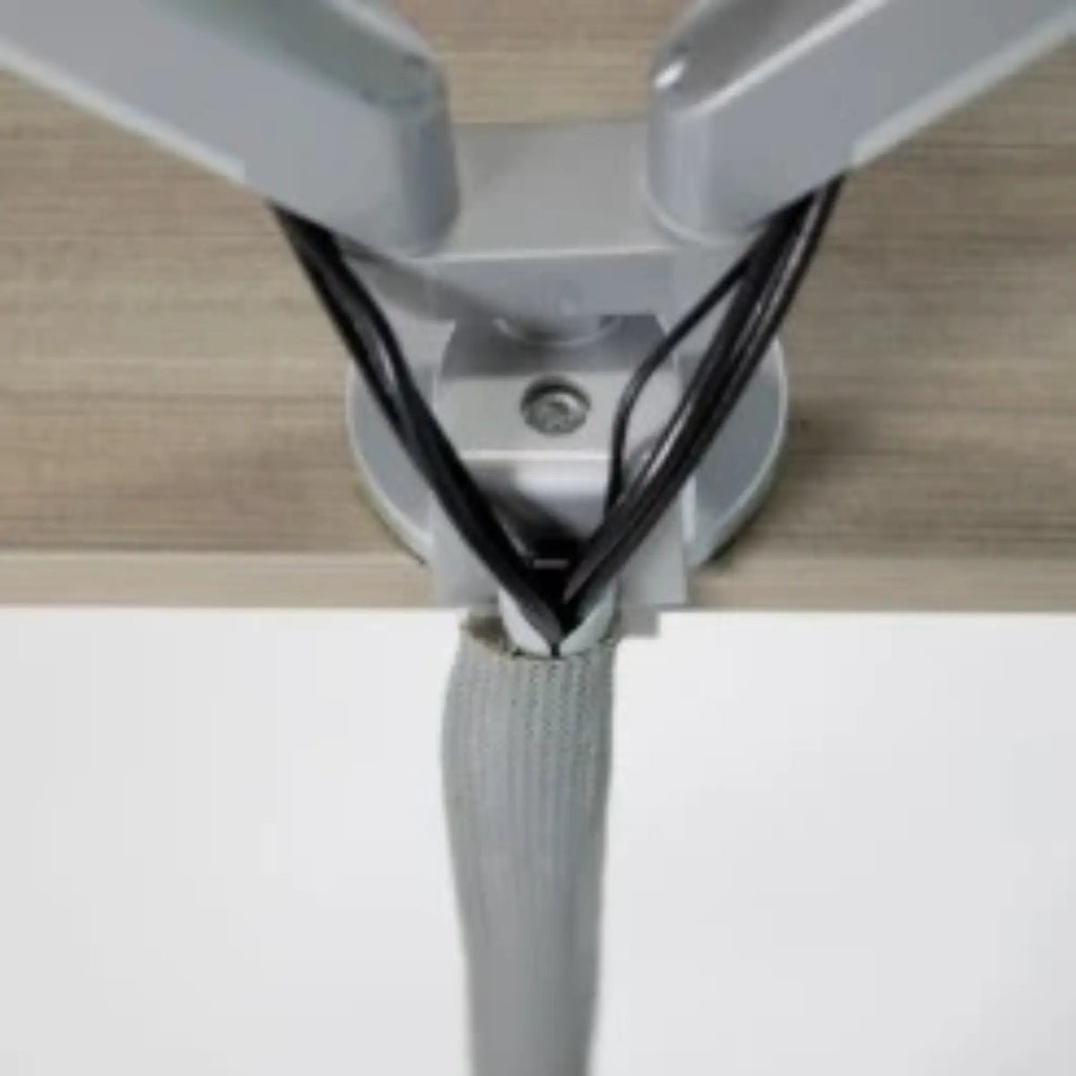 Monitor cables feeding into the 
Vertical Mesh Cable Sleeve