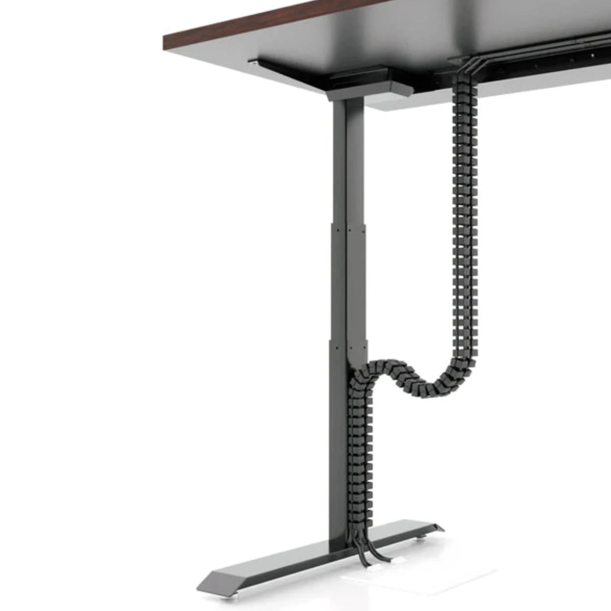 a black Magnetic Cable Manager system attached to a brown desk with black legs. The cable manager consists of a series of black, flexible segments that form a chain-like structure. It extends from the underside of the desk to the floor, effectively organizing and concealing cables that run from the desk to power sources or other devices